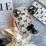 قاب ورق شاین شفاف طرح Cute Bow Tie با آویز مناسب گوشی آیفون